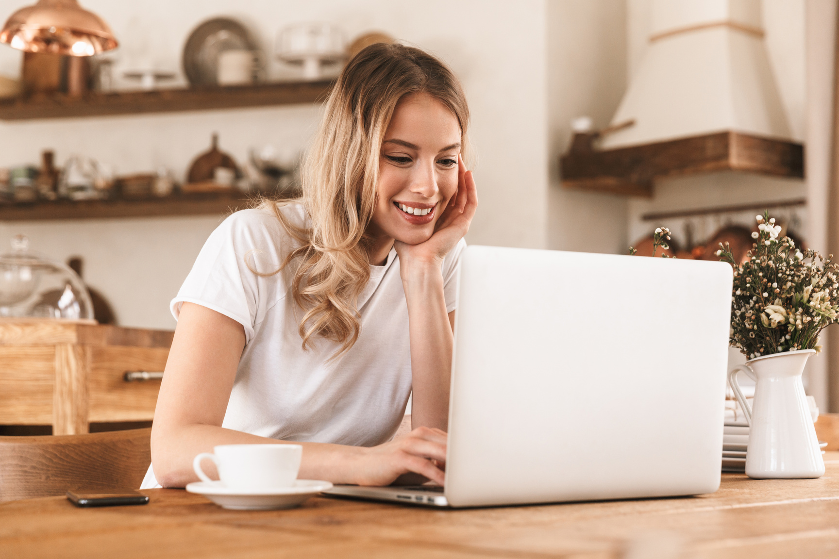 Portrait of Satisfied Blond Woman Working on Laptop