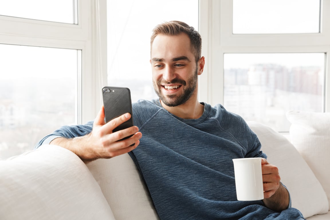 Young Man Using Phone