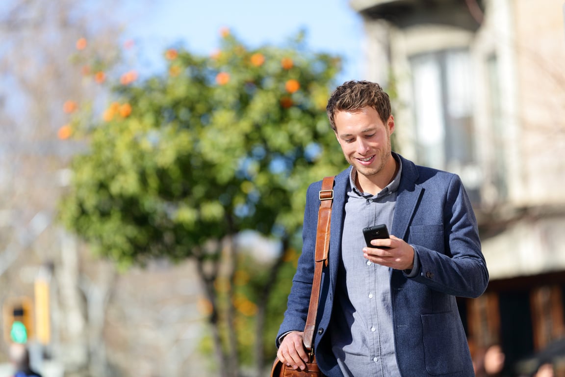 Young Urban Professional Man Using Smart Phone