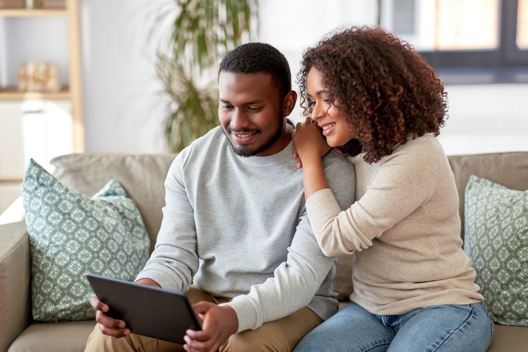 Young Couple with Tablet at Home