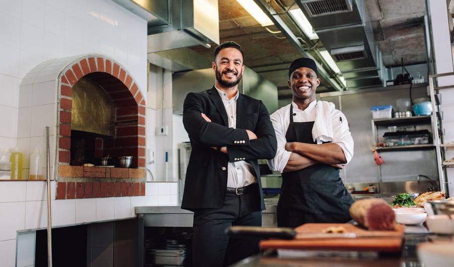 Restaurant Manager with Chef in Kitchen