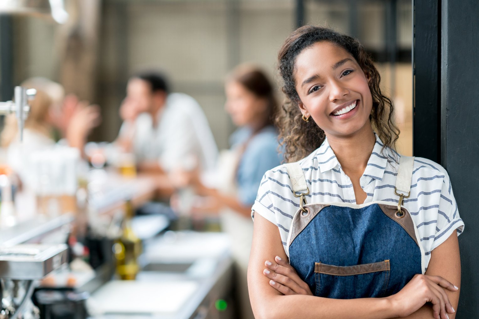 Happy waitress working at a restaurant